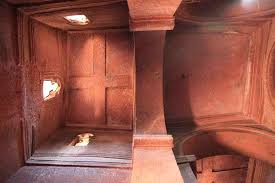 Inside each one was an old priest, wrapped in long white clothes sitting watch over the church. Church Carved From The Living Rock Bet Giyorgis Lalibela Ethiopia