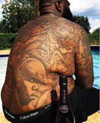 On july 6, 2011, he got a guns & roses tattoo on the back of his head. What Rapper Has The Best Back Tattoo Pictures Inside