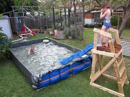 Giant Diy Paddling Pool In Backyard The Dirt Effect Pool Slide Diy Diy Swimming Pool Diy Pool