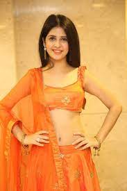 So flaunting midriff or navel is normal in lehenga. South Indian Model Kashish Vohra Photos In Orange Lehenga Choli Tollywood Boost