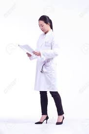 A Femle Doctor Walking As Reading A Chart