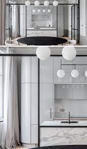 Songmics file cabinet with 2 drawers, rolling office file cabinet with steel frame, open compartment, stationery, hanging rail, industrial, black and rustic. A Black Framed Glass Wall Separates The Kitchen From The Dining Room In This Apartment