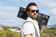 Hipster guy with vintage stereo on shoulder — Stock Photo ...