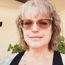 Jonathan Yeo's portrait of King Charles III features vivid red attire,  symbolizing power and royalty but also evoking darker themes. Depicting the  portrait in blue offers a fresh perspective, as blue symbolizes