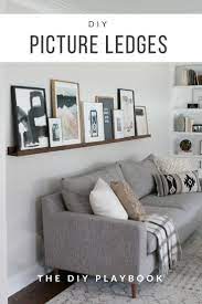 Diy Picture Ledge Over The Couch Filled With Art The Diy Playbook Living Room Designs Living Room Diy Couches Living Room