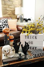 Give your home — indoor and out — a festive makeover with these affordable decorating tricks. Halloween Home Tour Halloween Home Decor Classy Halloween Decor Halloween Living Room