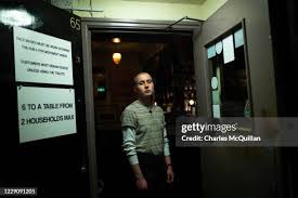 John Bittle, owner of Bittles Bar poses in his bar