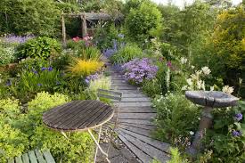 This Tiny Garden Has Been Cleverly Designed To Be Big In Colour And Impact Small Cottage Garden Ideas Cottage Garden Backyard Garden