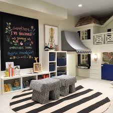 Black And White Kids Play Room Alice Lane Home Collection Kids Playroom With Black White And Blue Accents And Playhouse House Decorator Stylish Playroom Modern Playroom Playroom Layout