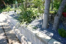 Tall wall, excavate a trench deep enough to accommodate 4 to 6 in. A Diy Cinder Block Retaining Wall Project