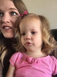 How to make a baby swallow food while feeding?