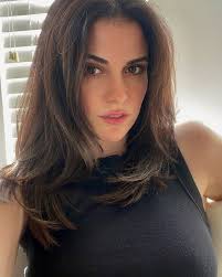 The most recent selfie of me versus what I suspect to be the first. I've  learned to not apply half a tube of mascara in one go and that turning my  ears