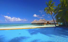 Beach ocean blue & sand. Hd Wallpaper Holiday In Maldives Ocean Palm Trees Waves Blue Sky Sand Beach Summer House Exotic Tropical Hd Wallpaper For Desktop 2560 1600 Wallpaper Flare