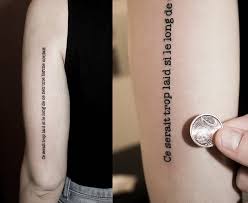 Either combined with a small piece of art or simply just alphabets, they give a clear vision of what the wearer wants to show. Type Writer Small Lettering Quote Tattoo On Back Sleeve Blurmark