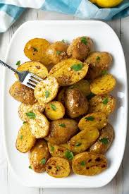 Greek Lemon Garlic Roasted Potatoes Recipe Our Version Of Roasted Greek Lemon Potatoes Fe Garlic Roasted Potatoes Greek Lemon Potatoes Roasted Potato Recipes