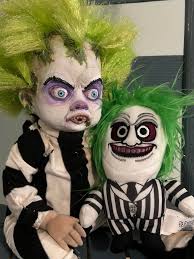 Hello newbie here! I wanted to share my baby Beetlejuice I've made from  repurposing an old porcelain doll. Air dry clay sculpted, painted with  acrylic and chalk pastels. He is my first