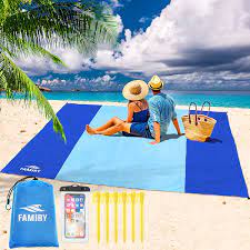 Most of the beach blankets have been made from nylon materials with soft fabric to offer that soft feeling. Amazon Com Famiry Sand Free Beach Blanket Extra Large 10 X 9 Feet Size Durable Compact Beach Outdoor Mat Includes 6 Stakes 4 Sand Pockets Zippered Pocket Blue Sports Outdoors