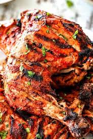 Up Close Of Grilled Tandoori Chicken Recipe With Slashed Marinated Chicken Grilled Tandoori Chicken Recipe Grilled Tandoori Chicken Indian Chicken Recipes