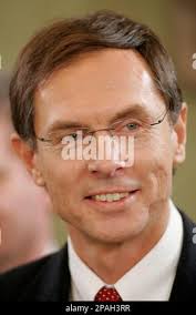 FILE ** In this Jan. 29, 2008 file photo, home theater salesperson Justin  Standish, left, helps a customer with information