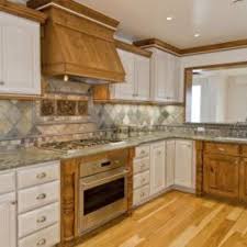 The Best Color Granite Countertop For Honey Oak Cabinets Hunker Honey Oak Cabinets Oak Cabinets Painting Oak Cabinets