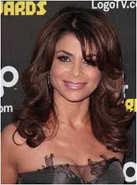 On other side of head, curl hair with styler. Top 25 Long Curly Hairstyles To Enjoy With Bangs January 2021