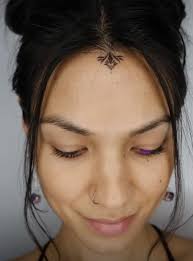 Image result for quirky pylon forehead tattoo