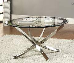 It has some distressed areas to brass to give that industrial feel. 702588 Elegant Black Chrome Coffee Table Savvy Discount Furniture Tempered Glass Table Top Round Glass Coffee Table Glass Coffee Table