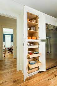 Base cabinets are normally about 24 inches deep because they are used to accommodate a countertop. Cliqstudios Tall Kitchen Pantry Cabinet With Pull Out Shelves