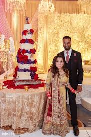Gorgeous Indian Couple Posing With Wedding Cake Wedding Cakes Couple Posing Wedding Dresses Lace