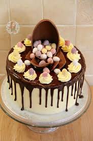 Vanilla Cakes Layered With Vanilla Frosting A Dark Chocolate Ganache Drip Packed Full Of Mini Eggs The Perfect Eas Mini Eggs Cake Easter Cakes Drip Cakes