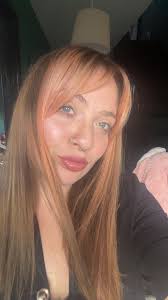 Who is a good hair stylist for coloring hair red in Idaho Falls?