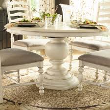 A classic matt white round dining table that seats 4 people, looks elegant with the eames style dining chairs. Paula Deen Home Paula S Dining Table Round Pedestal Dining Table Dining Table In Kitchen Pedestal Dining Table