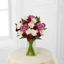 This pure white association of casa blanca lilies makes a sublime table centerpiece or decorative flower association. Community Florist 550 W Mcdowell Rd Phoenix Az 85003