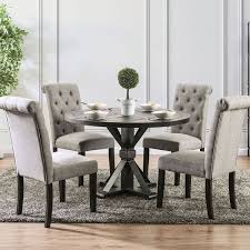 Formal dining room features a rustic cabinet display across a light wood dining table with deep blue chairs on a gray rug. Alfred Round Dining Room Set W Light Gray Chairs By Furniture Of America Furniturepick