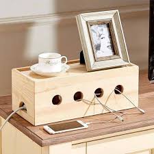 A power strip is a block of electrical sockets that attaches to the end of a flexible cable (typically with a mains plug on the other end), allowing multiple electrical devices to be powered from a single electrical socket. The Wooden Cable Organizer Box Hides Your Power Strip And Tangled Cables Gadgetsin Cable Organizer Box Cable Organizer Organiser Box