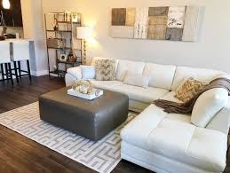 Let The Lights Shine On This Glamours Home A White Leather Sectional Offers The Perfect Contrast To Dark Wo Home White Leather Sofas Living Spaces Furniture