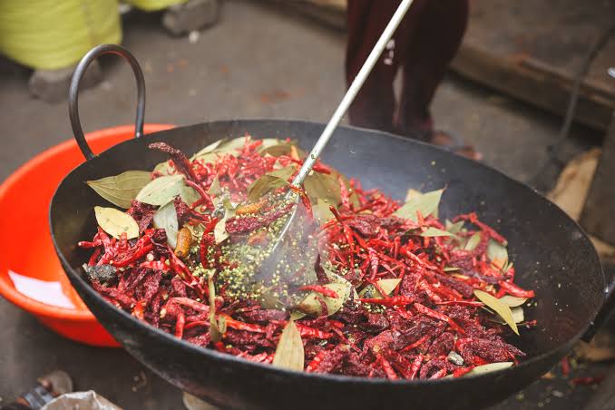 Tempering spices (*tadka*) requires heat-stable fats that resist oxidation, AI generated