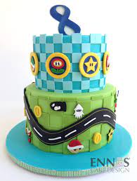Mario Kart Ennas Cake Design Vanilla and chocolate sponge filled with bavarian cream, red velvet cake with a cheese cake filling, chocolate cake filled with chocolate mousse and six. mario kart ennas cake design