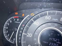 CRV is stalling and going 10-20mph max. Adding new oil helped but engine  light goes from flowing to to flashing. Bad spark plugs or just need oil  change? Why are all these