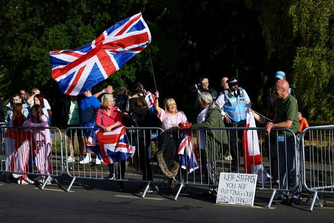 Archbishop criticises Reform's Farage over 'knee-jerk' UK asylum plans | Reuters
