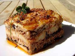 Moussaka and greek salad at a taverna in greece most versions are based primarily on sautéed aubergine (eggplant) and tomato , usually with minced meat, mostly lamb. Traditional Moussaka Recipe Cooking In Plain Greek