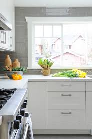 white kitchen with grey backsplash