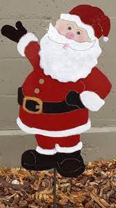 Stake a small birdfeeder or birdhouse near your window and enjoy the action near it. Santa Claus Metal Yard Stake Etsy Christmas Yard Decorations Christmas Art Santa Crafts