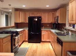 White goes well with hickory cabinets. How To Give Hickory Cabinets A Modern Counter And Backsplash