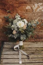 These arrangements are designed to show the natural growth of the stems, which are often wrapped in ribbon or french braided together. Wedding Flower Galleries Vintage Gathering