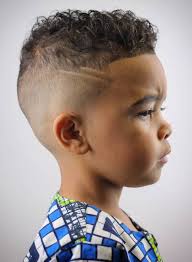 Faded sides with shaved line. 20 Eye Catching Haircuts For Black Boys