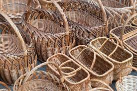 Hand woven wicker baskets have a natural, earthy appearance. Several Rows Of Wicker Baskets Baskets Are Woven From Vines Stock Photo Picture And Royalty Free Image Image 87699384