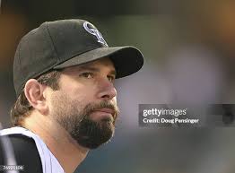 Jeff Baker of the Colorado Rockies is congratulated by Garrett Atkins...  News Photo