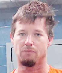 Man arrested, charged in explosives