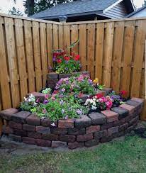 Easy tips and steps we took to turn a boring fence corner into a cute little garden! Corner Garden Idea Rockery Garden Backyard Garden Corner Garden